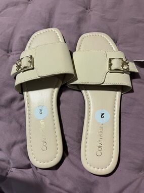 Calvin Klein Women's Beige Slide Mules with Gold Hardware